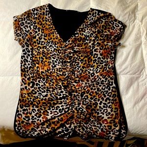 Cute leopard shirt! Brand New. Only worn 3 times.